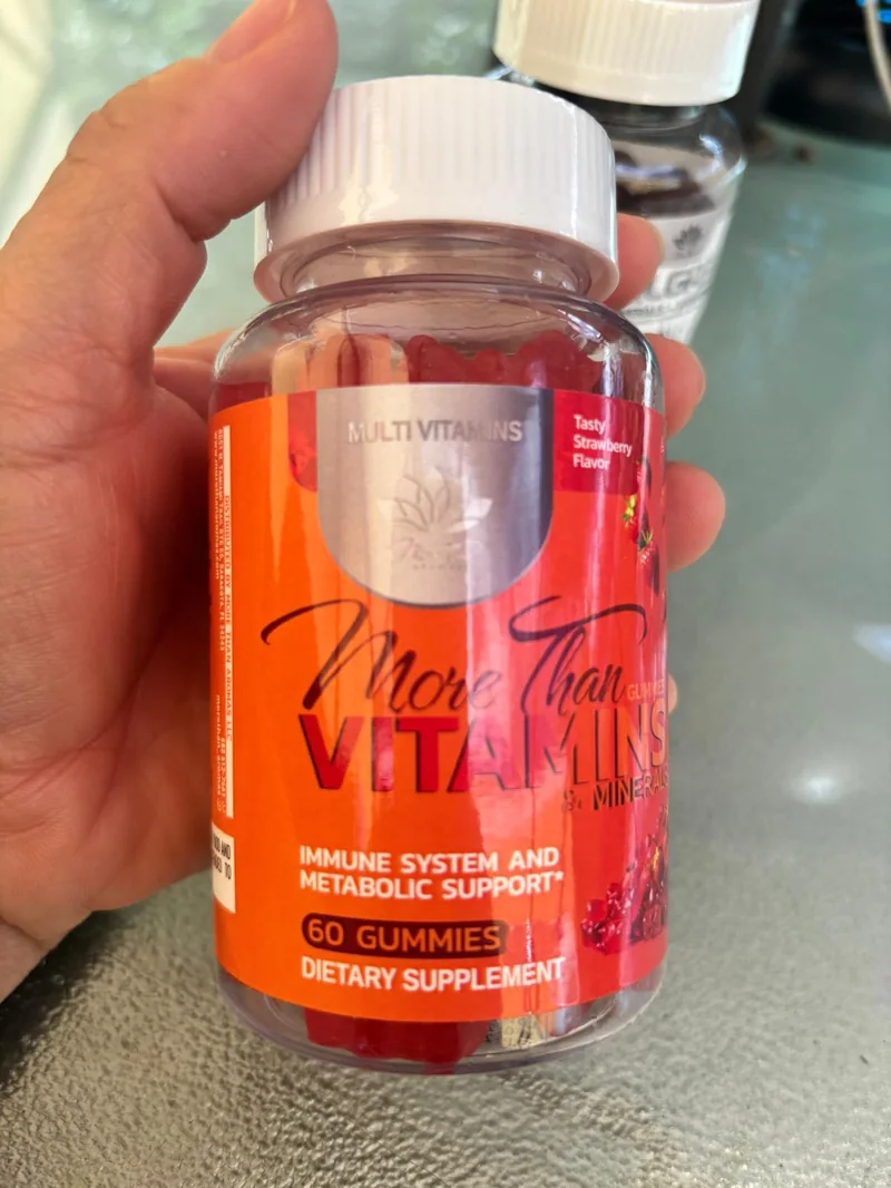 The real More Than Vitamins bottle held in hand